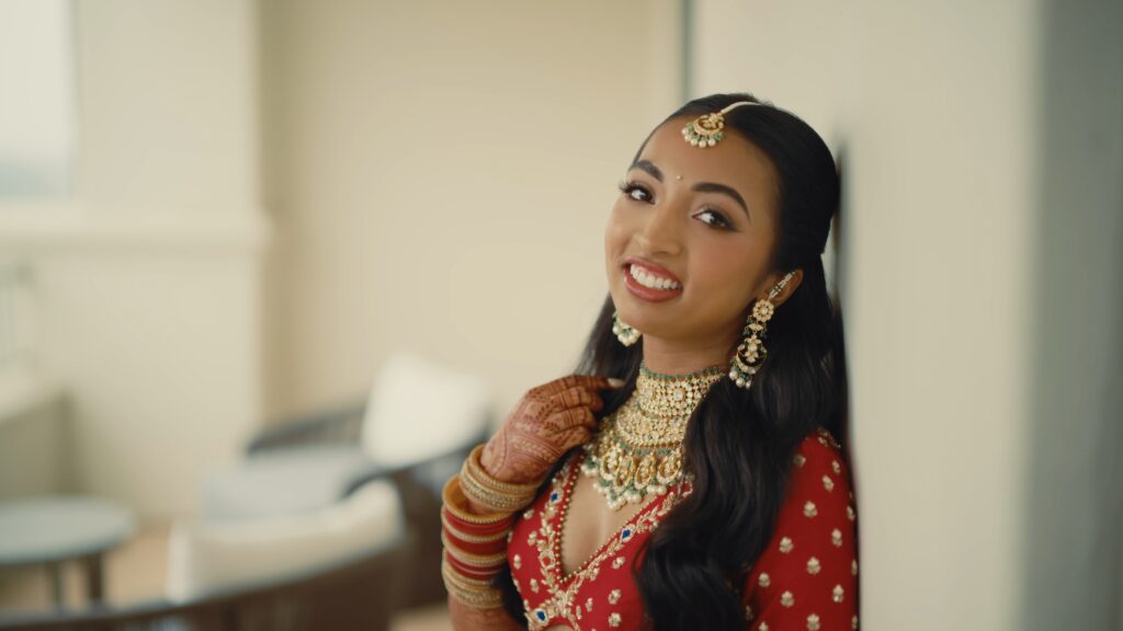 Beautiful Indian Bride showing necklace at a Dallas wedding venue