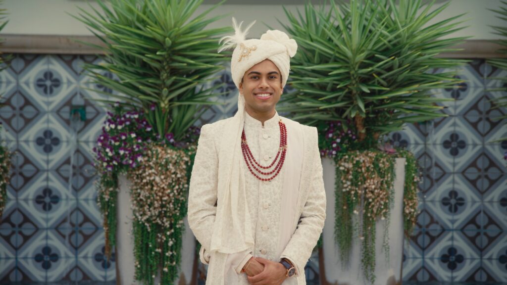 Handsome Indian Groom wearing Indian outfit at a Austin wedding venue.