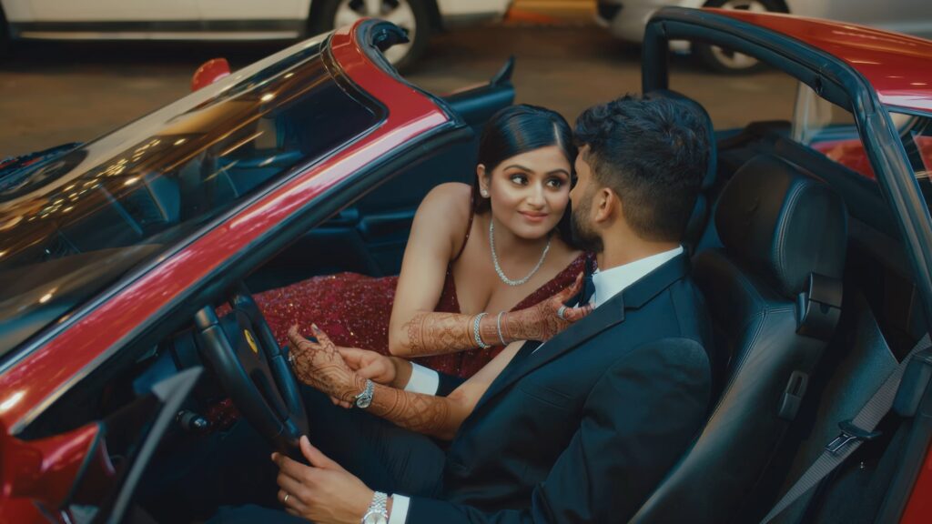 South Asian Bride and Groom in a ferrari sports car in Texas