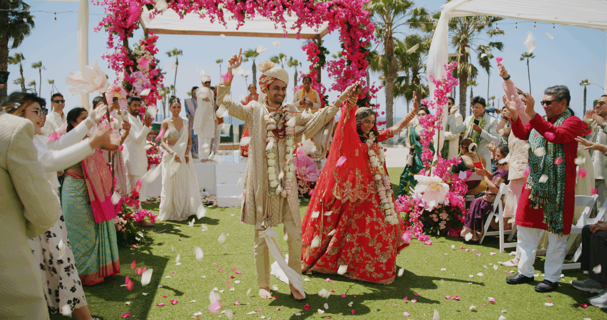 Beutiful Indian couple cheering during Recessional